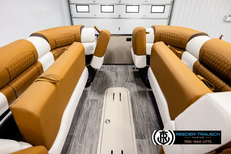 Slide: The Image of Luxurious interior of 2026 Avalon Excalibur LTD FL boat with tan and white seating. - 19