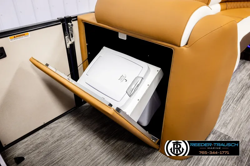 Slide: The Image of 2026 Avalon Excalibur LTD FL boat interior with built-in storage compartment. - 21