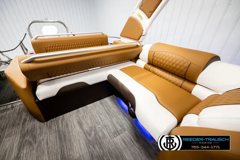 Slide: The Image of Luxurious interior seating of 2026 Avalon Excalibur LTD FL boat with tan and white upholstery. - 24