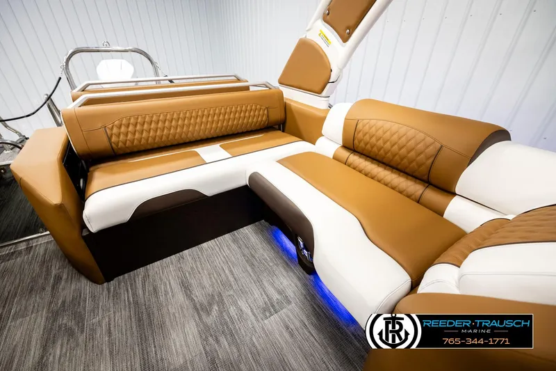 Slide: The Image of Luxurious seating in 2026 Avalon Excalibur LTD FL boat with tan and white upholstery. - 25
