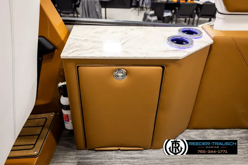 Slide: The Image of 2026 Avalon Excalibur LTD FL interior with marble countertop and cup holders. - 28