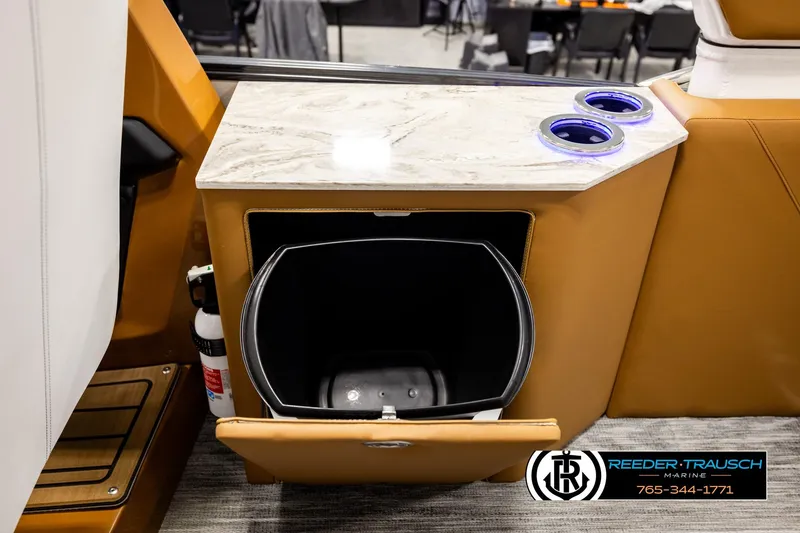 Slide: The Image of 2026 Avalon Excalibur LTD FL interior with marble countertop, cup holders, and storage compartment. - 29