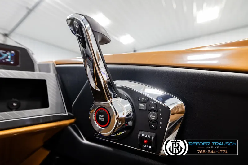 Slide: The Image of Close-up of 2026 Avalon Excalibur LTD FL boat control panel with start button. - 42