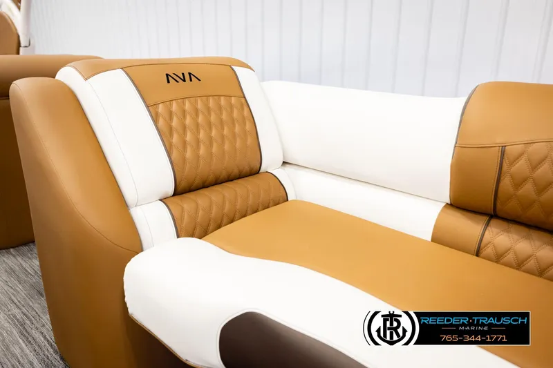Slide: The Image of Luxurious tan and white seating in 2026 Avalon Excalibur LTD FL boat interior. - 44