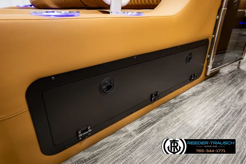 Slide: The Image of 2026 Avalon Excalibur LTD FL interior with tan seating and storage compartment. - 47