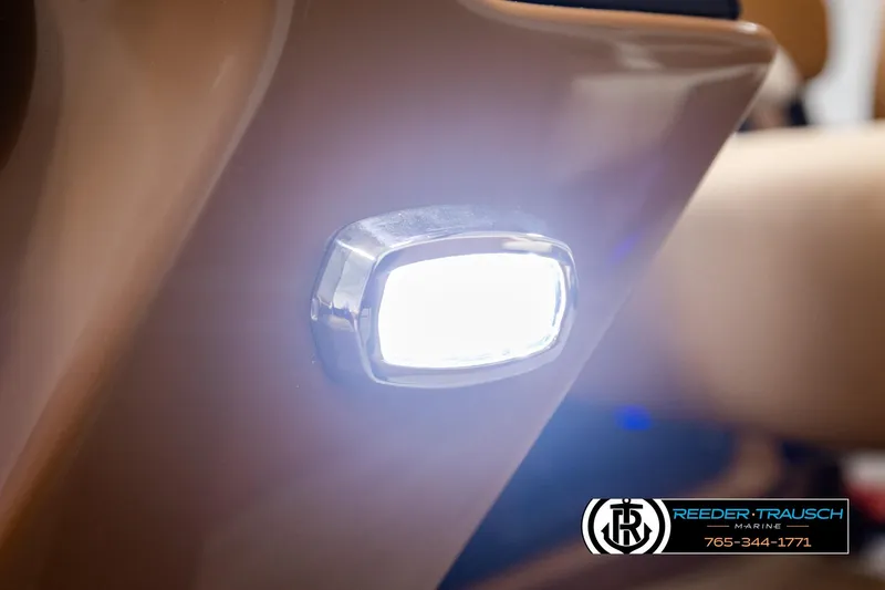 Slide: The Image of Close-up of 2026 Avalon Excalibur LTD FL boat light, glowing brightly. - 50