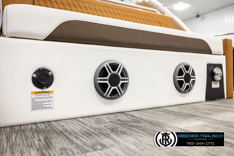 Slide: The Image of 2026 Avalon Excalibur LTD FL boat interior with speakers and warning label. - 52