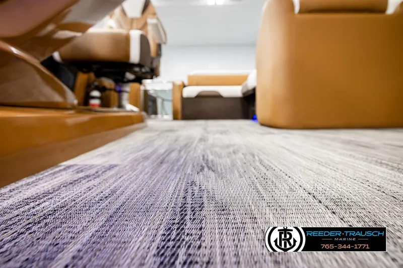 Slide: The Image of Luxurious interior of 2026 Avalon Excalibur LTD FL boat with plush seating and modern flooring. - 54