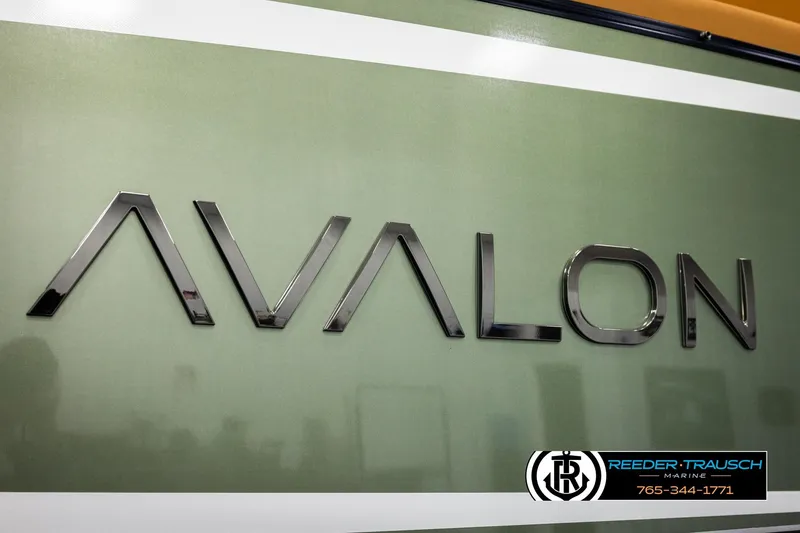 Slide: The Image of 2026 Avalon Excalibur LTD FL logo on green background, Reeder-Trausch Marine branding. - 61