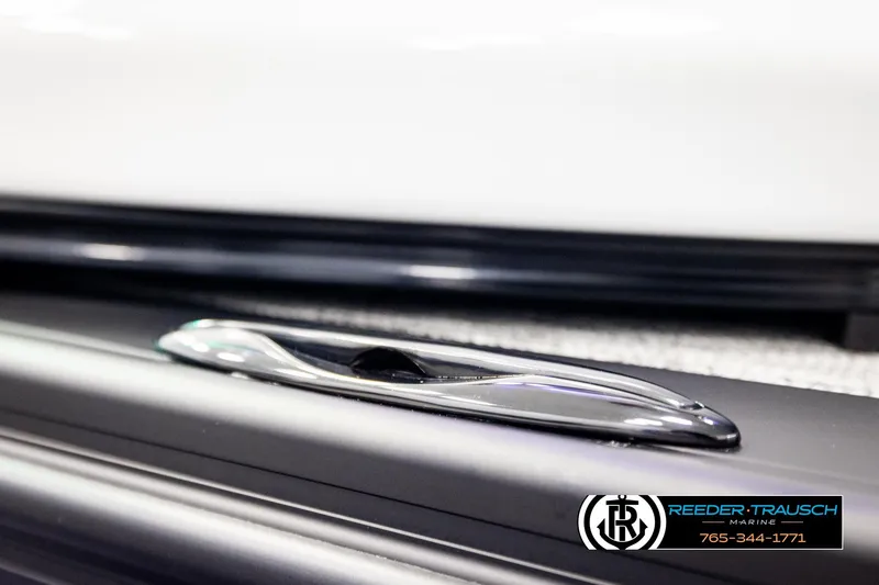 Slide: The Image of 2026 Avalon Excalibur LTD FL boat detail with sleek chrome cleat, Reeder-Trausch Marine branding. - 63