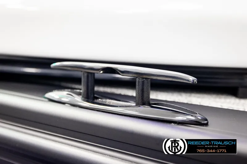 Slide: The Image of Close-up of 2026 Avalon Excalibur LTD FL boat cleat, featuring sleek design and Reeder-Trausch Marine logo. - 64