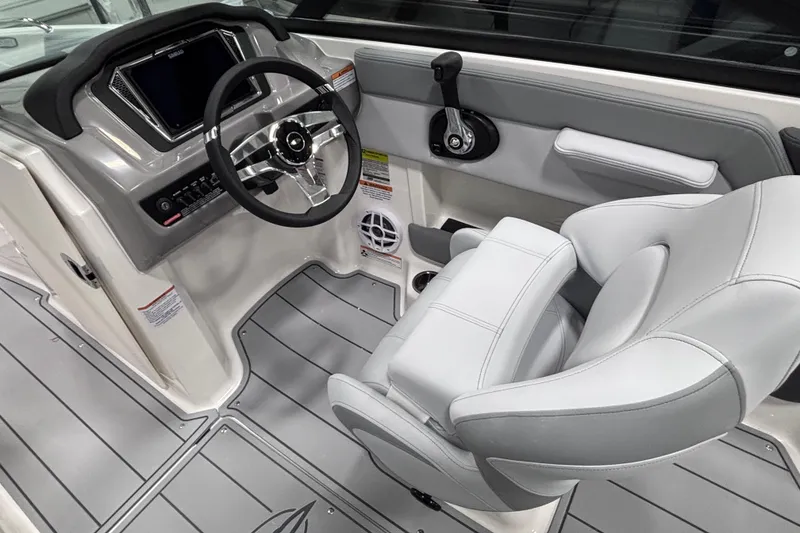 Slide: The Image of 2026 Chaparral 21 SSi boat interior with modern steering and controls. - 14