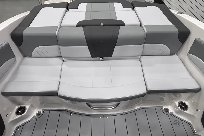 Slide: The Image of 2026 Chaparral 21 SSi boat interior with gray and white cushioned seating. - 17
