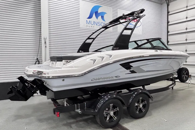 Slide: The Image of 2026 Chaparral 21 SSi boat on trailer in showroom, side view. - 6