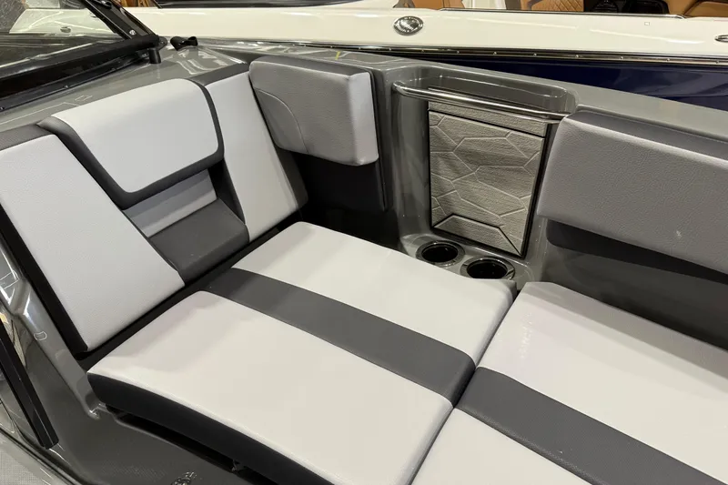 Slide: The Image of 2025 Yamaha Boats 222XD interior seating with modern design and cup holders. - 7