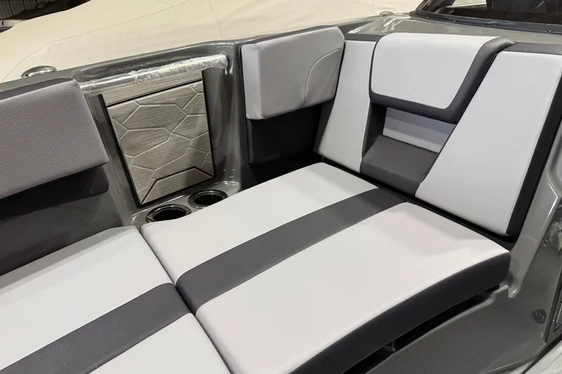 Slide: The Image of 2025 Yamaha Boats 222XD interior seating with modern design and cup holders. - 9