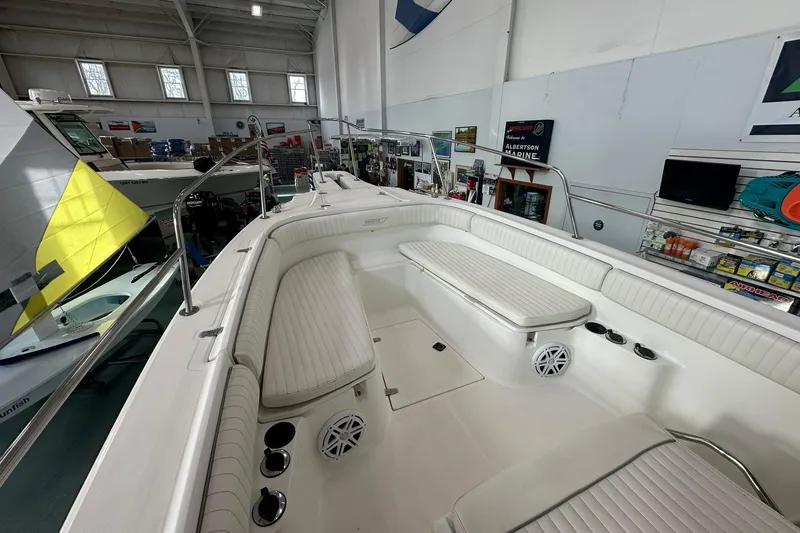 Slide: The Image of 2001 Boston Whaler 26 Outrage boat interior with white seating in showroom. - 19