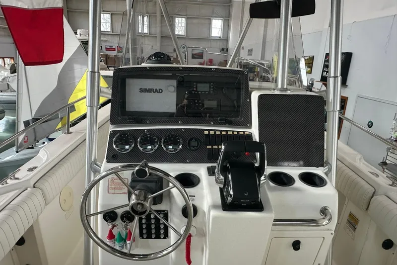 Slide: The Image of 2001 Boston Whaler 26 Outrage boat dashboard with Simrad navigation system. - 9