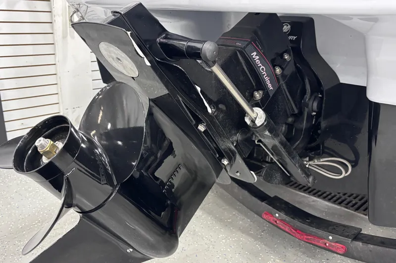 Slide: The Image of 2026 Chaparral 21 SSi boat with MerCruiser engine and propeller detail. - 10