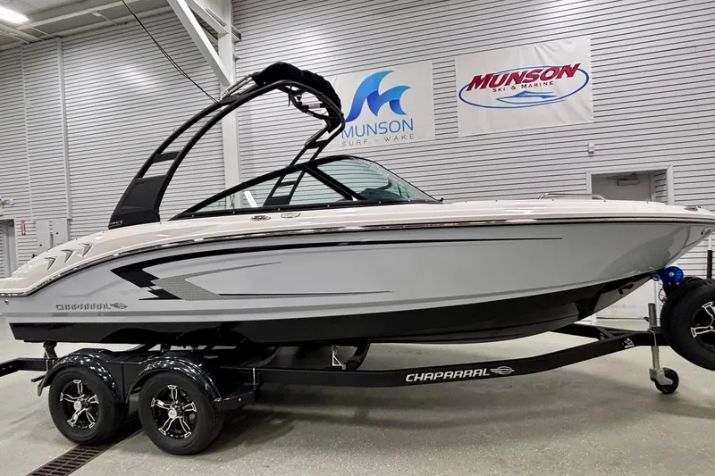 Slide: The Image of 2026 Chaparral 21 SSi boat on trailer in showroom, Munson Ski & Marine. - 2