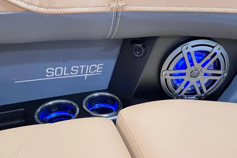 Slide: The Image of 2025 Harris Solstice 230 interior with illuminated speakers and cup holders. - 11