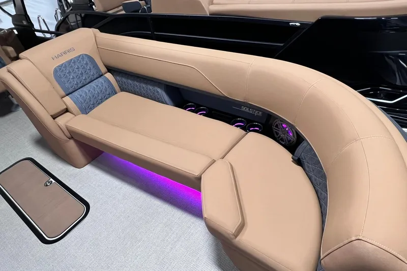 Slide: The Image of Luxurious seating on 2025 Harris Solstice 230 boat with ambient purple lighting. - 6
