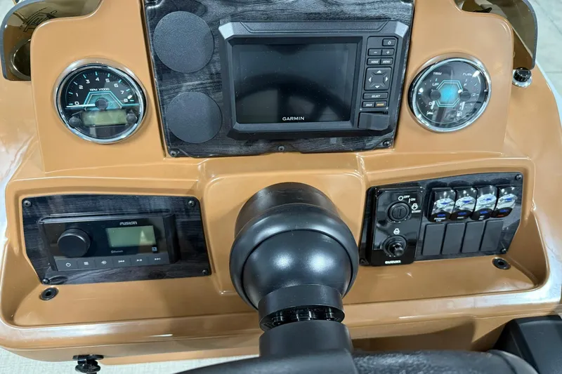 Slide: The Image of Dashboard of 2026 Avalon Venture Cruise 21' with Garmin navigation and control panel. - 17