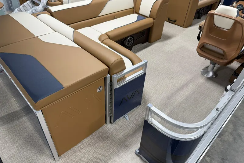Slide: The Image of Interior of 2026 Avalon Venture Cruise 21' boat with tan and blue seating. - 7