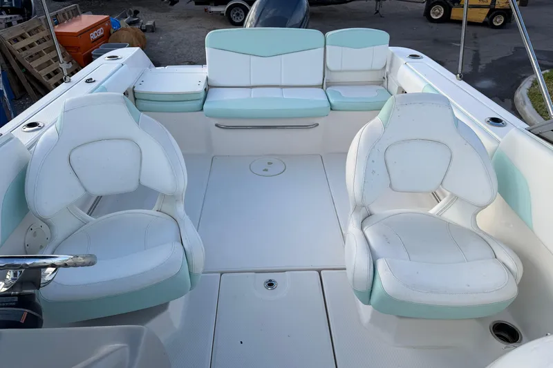Slide: The Image of 2020 Robalo R207 Dual Console boat interior with white and mint seating. - 5