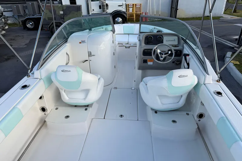 Slide: The Image of 2020 Robalo R207 Dual Console boat interior with white and mint seating. - 6