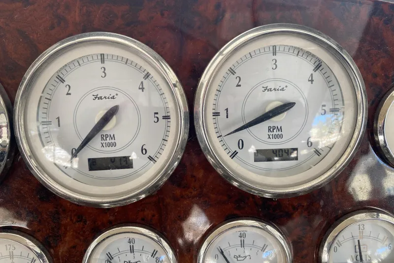 Slide: The Image of Close-up of 2008 Regal 3360 Window Express RPM gauges on a wooden dashboard. - 14