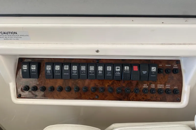 Slide: The Image of Control panel of a 2008 Regal 3360 Window Express boat with labeled switches and buttons. - 17