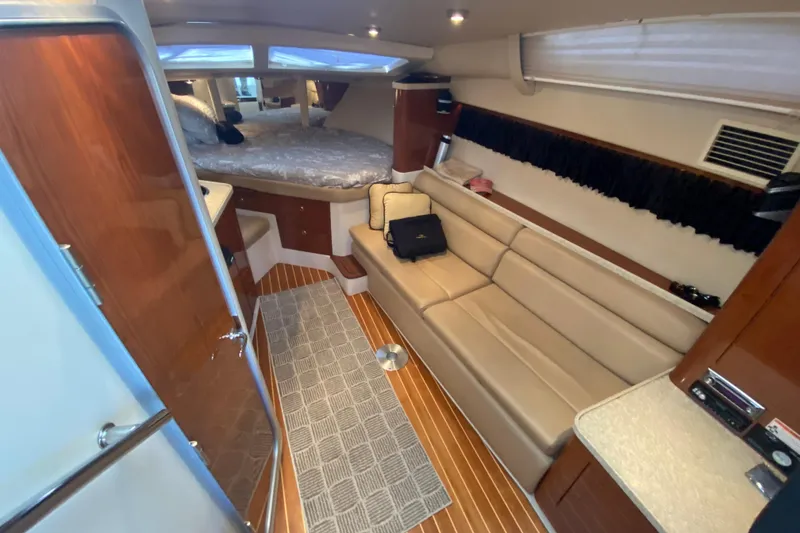 Slide: The Image of Interior of 2008 Regal 3360 Window Express yacht with cozy seating and sleeping area. - 20