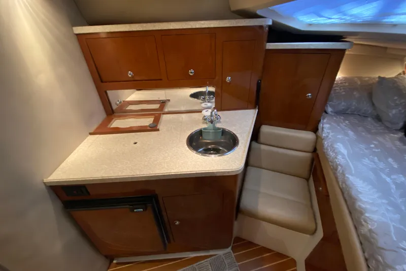 Slide: The Image of 2008 Regal 3360 Window Express cabin interior with kitchenette and bed. - 24