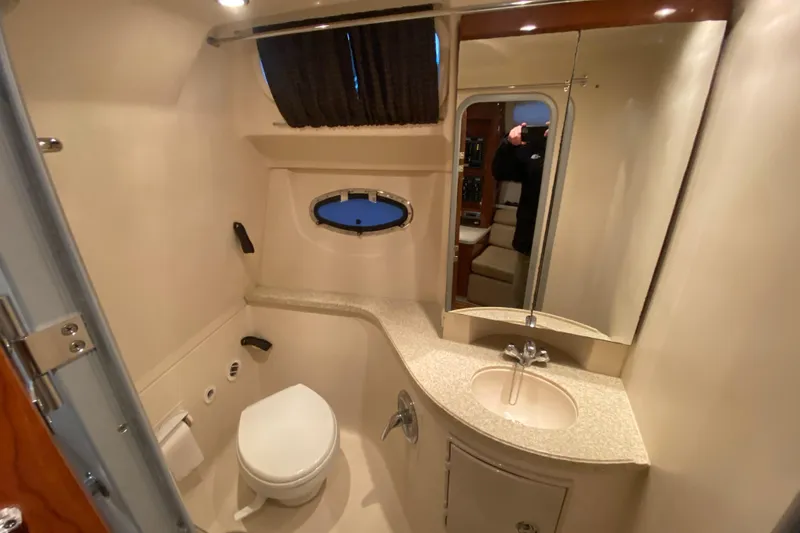 Slide: The Image of 2008 Regal 3360 Window Express bathroom with sink, toilet, and mirror. - 33
