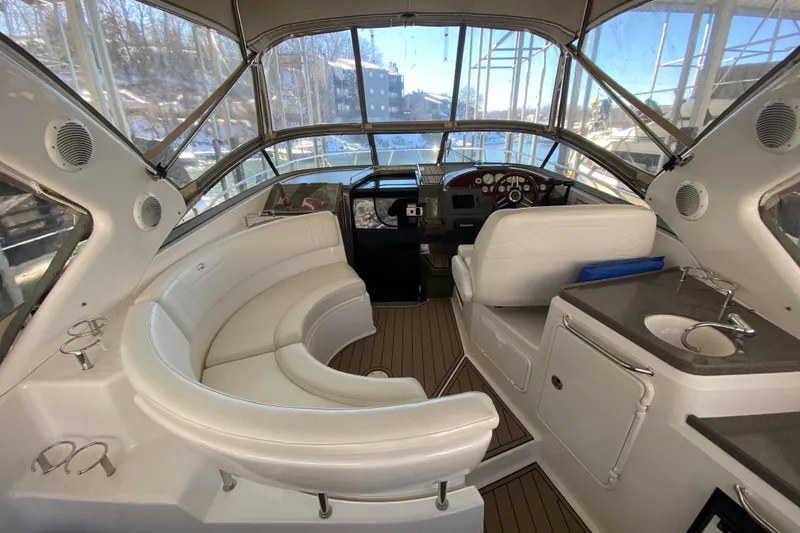 Slide: The Image of 2008 Regal 3360 Window Express boat interior with seating and helm. - 40