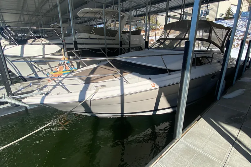 Slide: The Image of 2008 Regal 3360 Window Express boat docked in a covered marina. - 5