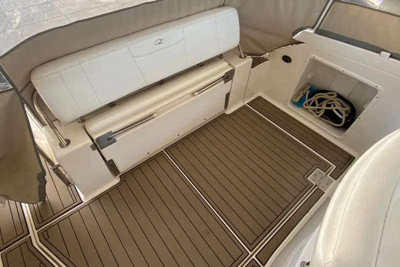 Slide: The Image of 2008 Regal 3360 Window Express boat interior with seating and storage compartment. - 7