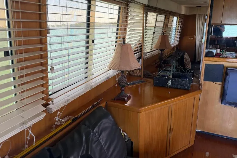 Slide: The Image of Interior of 1993 McKinna 48 Pilothouse with wooden blinds and decorative lamps. - 129