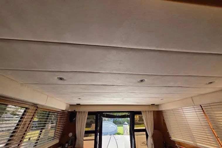 Slide: The Image of Interior view of 1993 McKinna 48 Pilothouse yacht with ceiling and windows. - 30