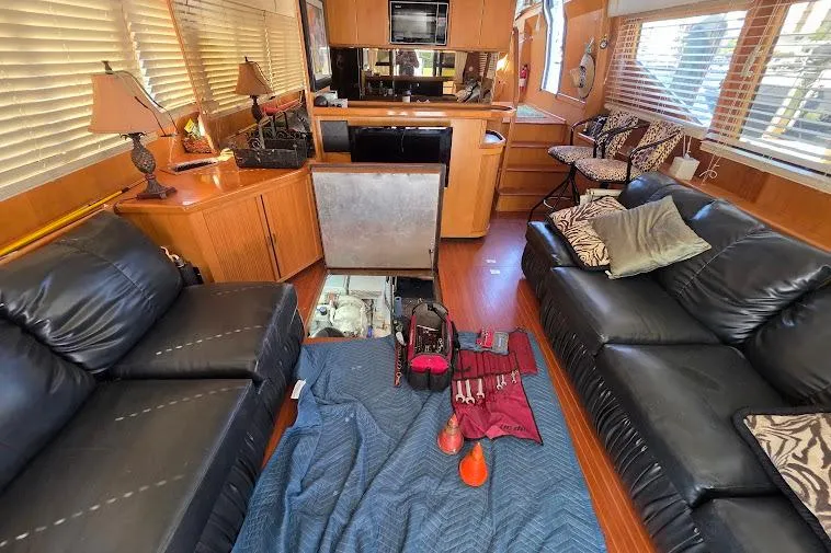 Slide: The Image of Interior of 1993 McKinna 48 Pilothouse with leather sofas and kitchen area. - 59
