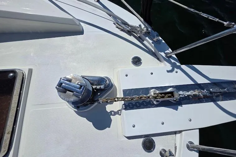 Slide: The Image of Anchor chain and windlass on 1993 McKinna 48 Pilothouse yacht deck. - 65