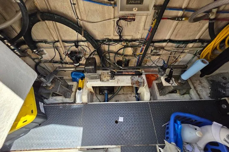 Slide: The Image of Engine room of a 1993 McKinna 48 Pilothouse with visible wiring and equipment. - 78
