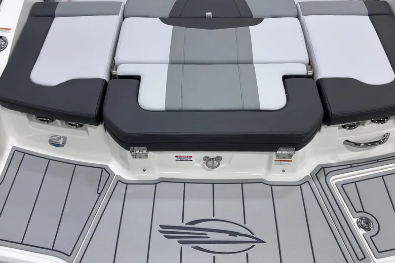 Slide: The Image of 2026 Chaparral 21 SSi boat interior with sleek seating and stylish flooring design. - 19