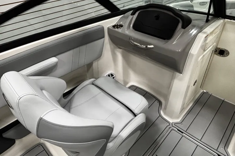 Slide: The Image of 2026 Chaparral 21 SSi boat interior with gray seating and sleek dashboard design. - 24