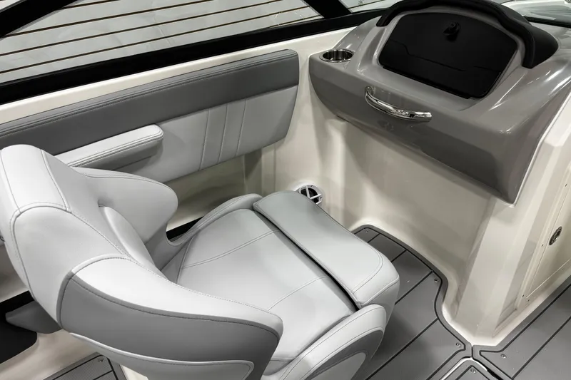 Slide: The Image of 2026 Chaparral 21 SSi boat interior with gray seating and dashboard. - 30
