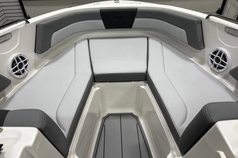 Slide: The Image of 2026 Chaparral 21 SSi boat interior with gray and white seating and built-in speakers. - 33