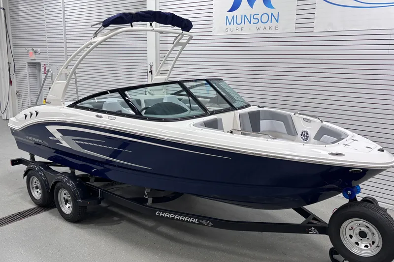 Slide: The Image of 2026 Chaparral 21 SSi boat on trailer in showroom, Munson Surf Wake. - 9