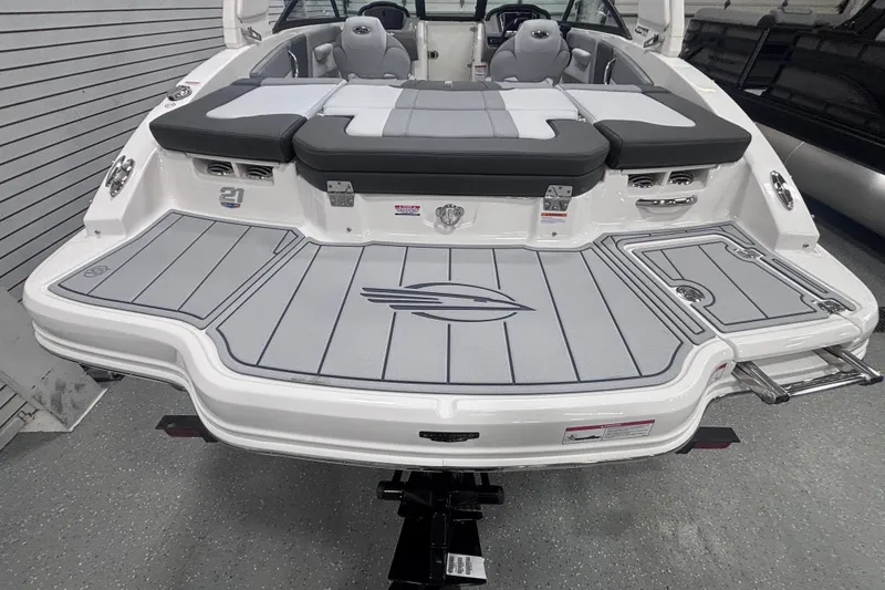 Slide: The Image of 2026 Chaparral 21 SSi boat with sleek gray deck and comfortable seating. - 13