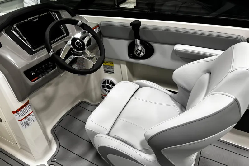 Slide: The Image of 2026 Chaparral 21 SSi boat interior with steering wheel and captain's seat. - 29